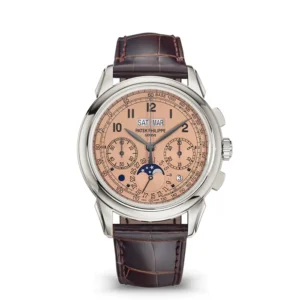A watch with brown leather strap and silver face.