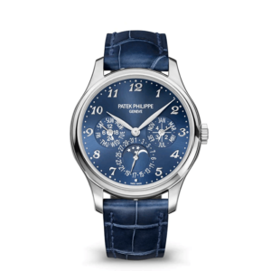 A blue watch with a silver case and leather strap.