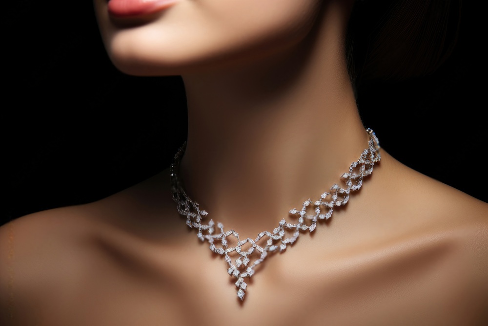 A woman wearing a necklace with pearls on it.